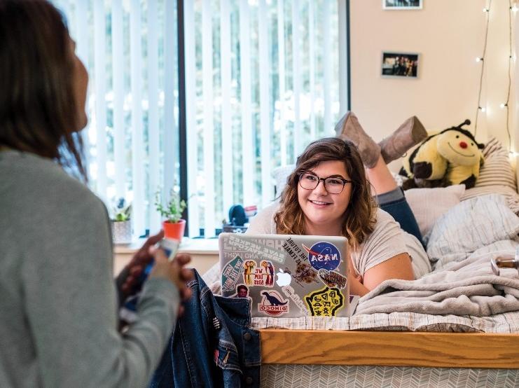 students talking in residence hall